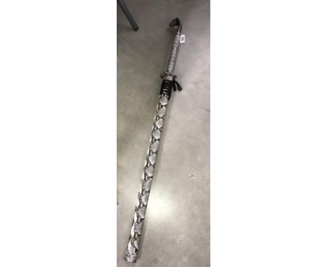 An ornamental Samurai sword with snake scabbard and cobra snake finial