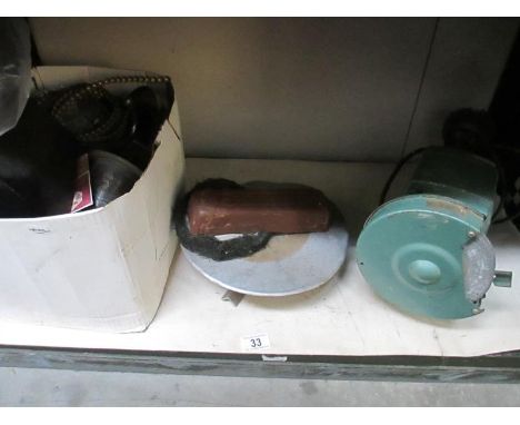 A bench grinder with polisher attachments etc.