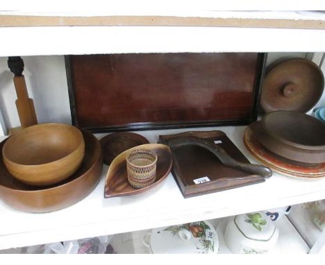 A shelf of wooden bowls and trays etc.