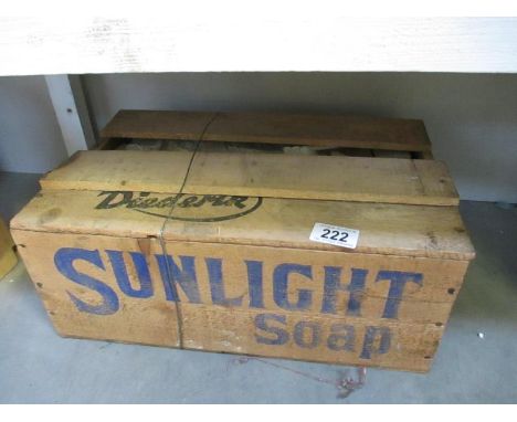 A vintage sealed wooden box of sunlight soap, one part of box lid removed to show contents, original box and they appear to b