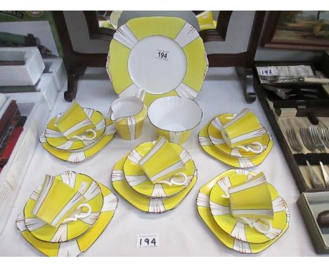 An art deco style yellow tea set marked English china