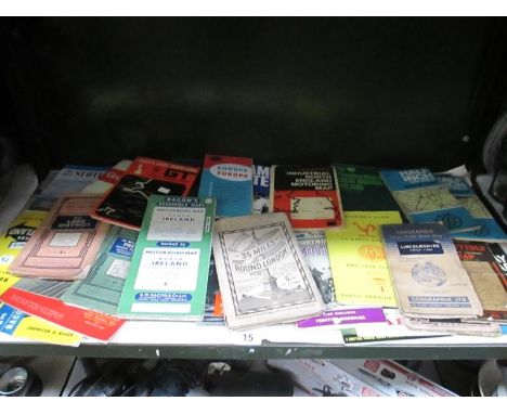 A shelf of vintage road maps