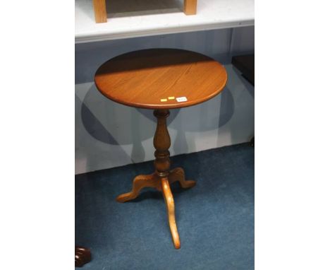 An oak Ercol tripod table