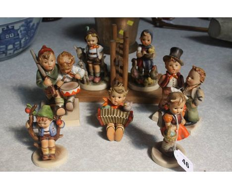 A collection of Hummel figures