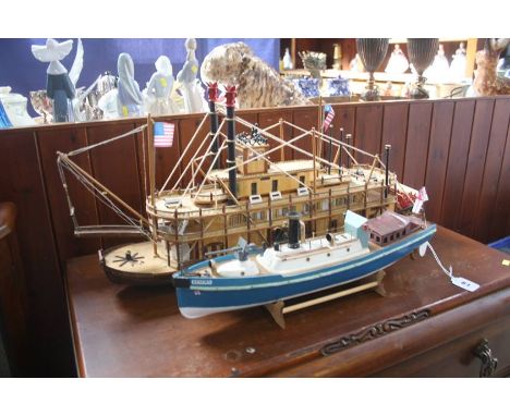 A model paddle steamer and one other