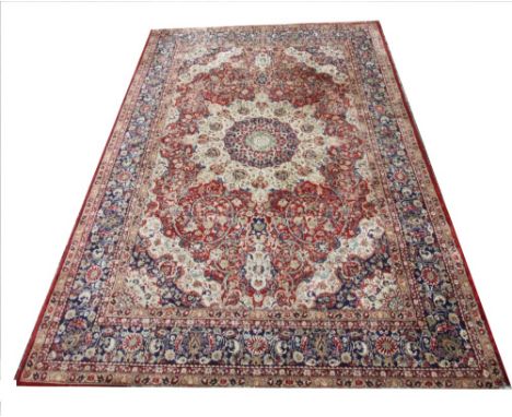 A modern silk Persian pattern carpet, the traditional design in shades of red, white and blue, 345cm x 245cm For condition in