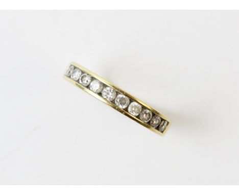 A diamond set half eternity ring, the ten brilliant cut diamonds, all channel set in 18ct yellow gold, weight 3.7gms, size N 