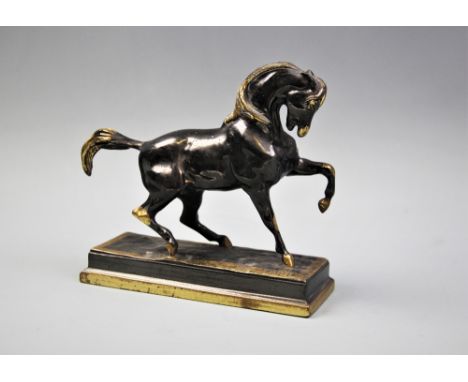 After Antoine-Louis Barye (French 1795-1875), a bronze-patinated statue modelled as a prancing horse, probably after an origi