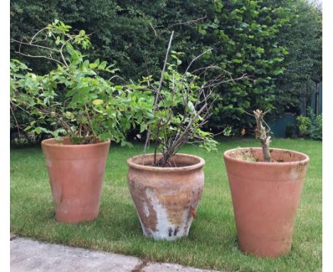 A pair of terracotta jardinieres/planters, each of tapered cylindrical form, embossed with 'Yorkshire Flower Pots', 40cm high