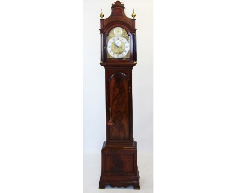 A late 18th century mahogany cased eight day long case clock by Adam Travers, London, the pagoda shaped hood with brass finia