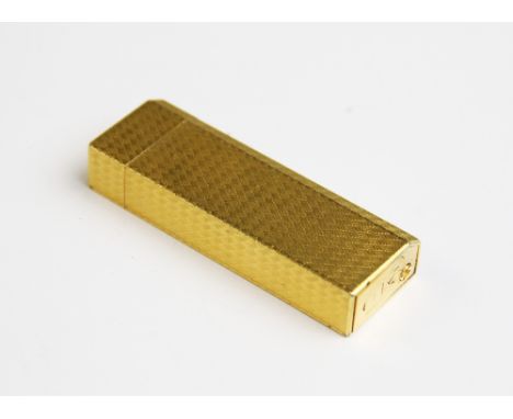 A Must de Cartier gold plated lighter, of rectangular form with engine turned decoration to exterior, serial no. 87533V, 72mm
