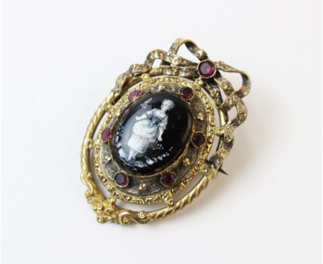 A Victorian enamel and stone set brooch, the central hand painted panel depicting a maiden in 19th century attire, set to a p