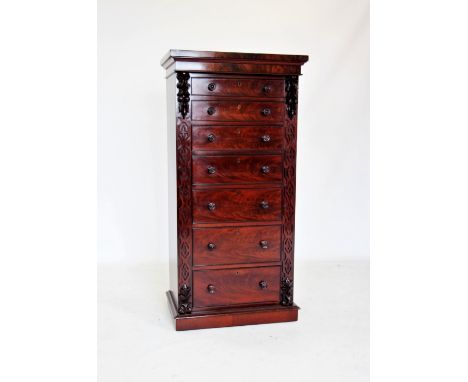 A mid 19th century mahogany Wellington chest, the rectangular top above seven graduated and cock beaded drawers applied with 