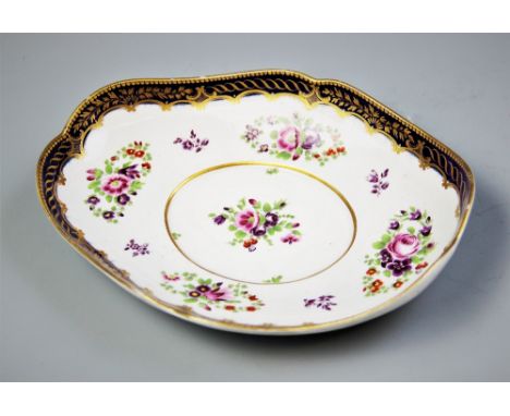 A Worcester porcelain polychrome decorated dish, late 18th century, the dish of oval form with shaped rim, the interior decor