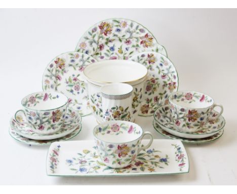 A Minton 'Haddon Hall' part tea service, comprising: three cups, three saucers, three side plates, a circular cake plate, a r