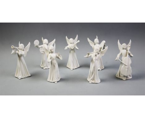 A seven piece Dresden porcelain angel orchestra, mid 20th century, the white glazed figures modelled as standing angels playi