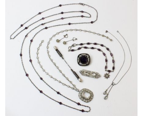 A selection of lady's vintage costume jewellery, to include a silver paste set drop necklace, a white metal chain set with am