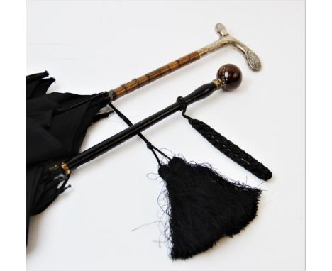 An Edwardian silver handled lady's parasol, London 1907, the parasol with black silk canopy, the handle with cast Art Nouveau