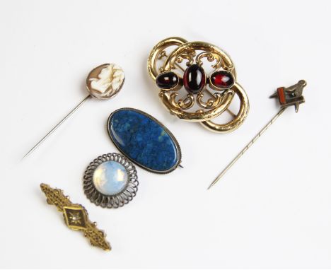 A selection of Victorian and later brooches and pins, to include a Victorian love knot brooch, comprising three polished past