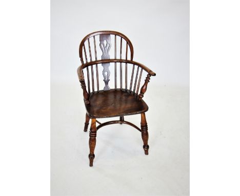 A late 18th/early 19th century elm and ash windsor elbow chair, the hoop back with a central pierced splat, above a shaped an