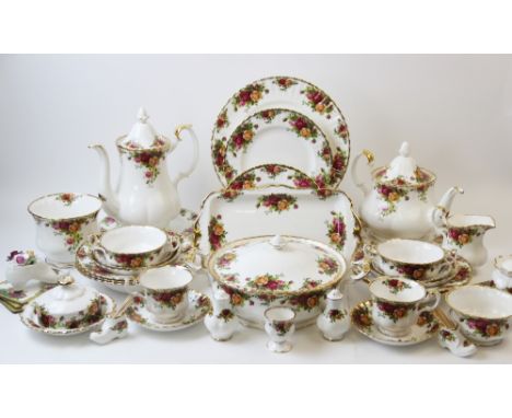 An extensive Royal Albert 'Old Country Roses' dinner and tea service, comprising: 23 dinner plates, 13 side plates, 12 handle