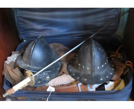 A suitcase containing a quantity of costumes, relating to the Sealed Knot Enactment Society, together with three helmets, a s
