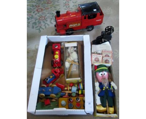 A tin plate Tri-Ang Puff Puff engine, a Bingo Scope Safety Cinema, together with Pathe Scope films, Pelham puppets and other 