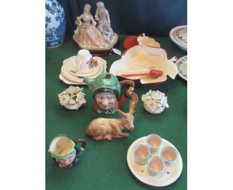 A Carltonware leaf shaped salad bowl, together with a Carltonware cruet, a Beswick Reindeer, a Lladro-style figure, coronatio