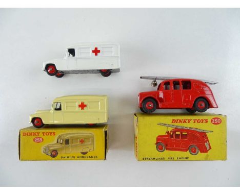 A pair of DINKY 253 Daimler Ambulances in cream and white (one boxed), together with a restored 250 Streamlined Fire Engine i