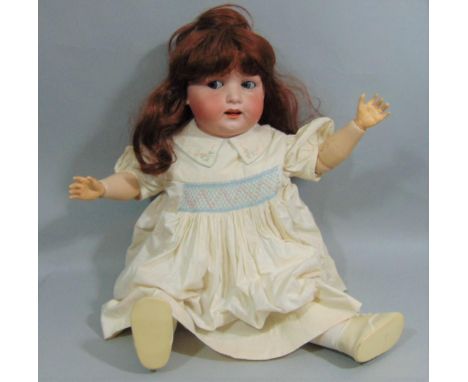 A Heubach of Köppelsdorf bisque head doll, impressed ' Koppelsdorf DRGM Thuringia', with chubby face, blue closing eyes that 