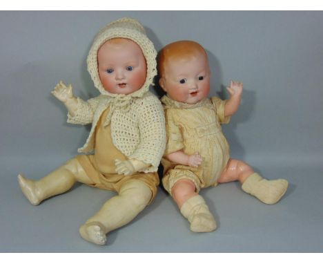 2 bisque heads baby dolls both with 5 piece composition bent limb bodies; smaller doll is by Armand Marseille with fixed brow