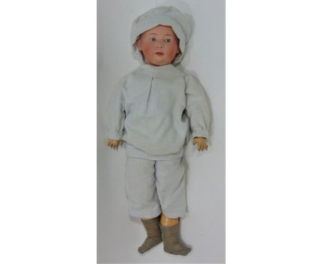 Gebruder Heubach  bisque head boy doll with moulded hair, fixed intaglio eyes with highlight spot, closed mouth and compositi