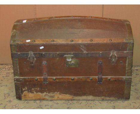 A vintage wooden canvas steel and timber lathe bound domed top cabin trunk with stitched leather carrying handles 82 cm long 
