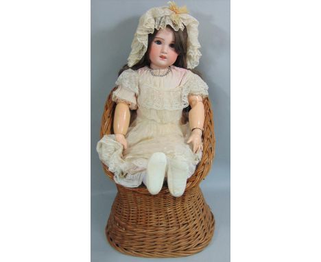 Early 20th century SFBJ  bisque socket head doll, 82cm tall, feathered brows, brown eyes, open mouth with upper teeth, long b