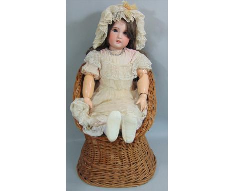 Early 20th century SFBJ  bisque socket head doll, 82cm tall, feathered brows, brown eyes, open mouth with upper teeth, long b