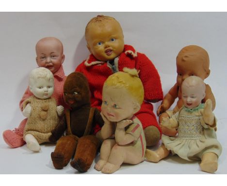 Collection of 7 small dolls including a Norah Welling black velvet doll in dungarees, a bisque head 'Kaiser baby' type doll  