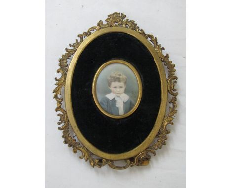 Late 19th century school miniature portrait of a young boy in grey jacket and white collar, watercolour on card? (not removed