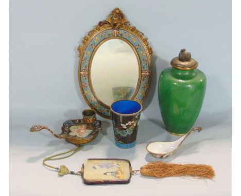 A mixed collection of cloisonné and champlevi enamel wares to include an oval mirror with cloisonné framework mounted with a 