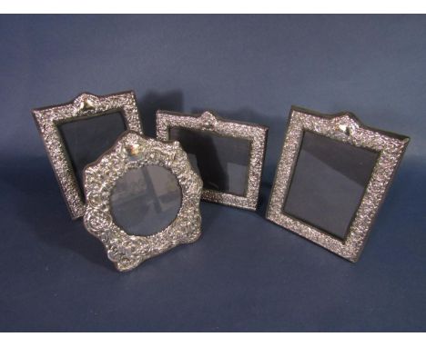 Four silver applied easel frames with blue baize backing, two 19 x 13.5cm, a further landscape example, 15 x 17.5cm and a fur