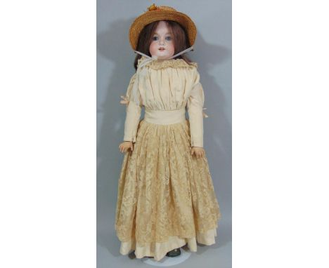 Early 20th century Armand Marseille doll  with stand, mold 370  with bisque shoulder-head, kid body and legs, and jointed com
