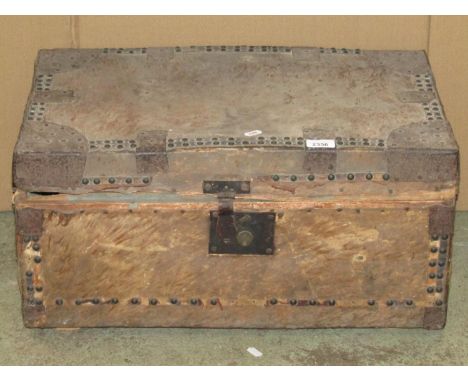A 19th century pony skin covered wooden trunk with studded detail and iron fittings (AF), 61 cm long x 38 cm wide x 30 cm hig