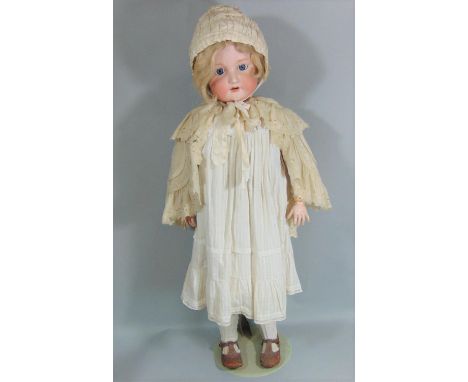 1920's Armand Marseille large doll with stand, mold 390 with bisque socket head and composition body with jointed limbs. Blue