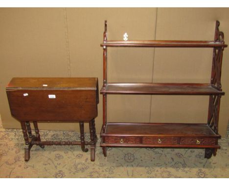 A reproduction Chippendale style flight of open wall shelves with blind and pierced fretwork detail, together with a small Ed