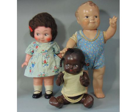 3 composition dolls; early 20th century doll with Kewpie body shape, googly eyes, pedestal legs, jointed arms and mohair wig,