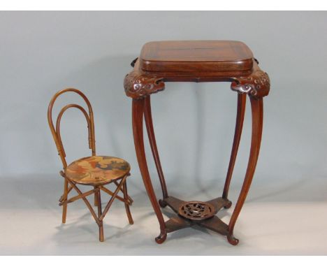 A good quality Chinese rosewood lamp/vase table of small proportions, with carved Greek key rim and further scrolled carvings