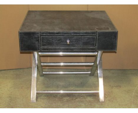 Attributed to Andrew Martin - a chrome and faux stitched leather occasional/lamp table with frieze drawer raised on x framed 