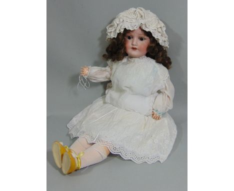 CM Bergmann Waltershausen bisque socket headed doll, with fixed brown eyes, open mouth with top teeth showing, brown hair in 