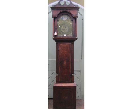 An 18th century oak longcase clock, the case with simple shell inlay detail, the trunk with reeded and canted corners, the ho