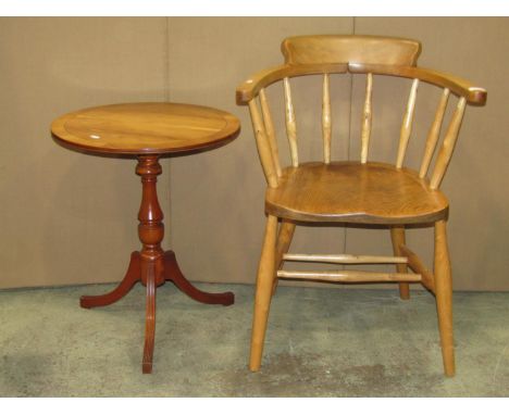 A light elm and beechwood smokers bow type chair with simple turned spindle back over a saddle shaped seat together with thre