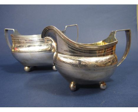 Good quality George III silver milk jug and twin handled sucrier with engraved geometric bands and gilt interior, upon four b